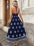 Back view of navy blue boho halter maxi dress with open back and halter tie