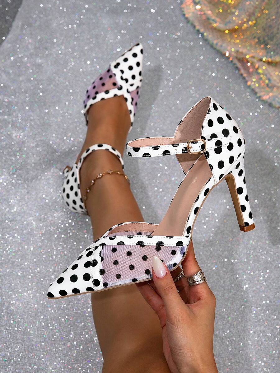 16 media show women polka dot pointed toe pumps in white/black variants with ankle bow wrap or buckle strap, stiletto or chunky block heel, sheer mesh panels on some styles. image 10