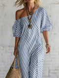 Front crop of blue striped one shoulder dress with puff sleeves and vertical stripes