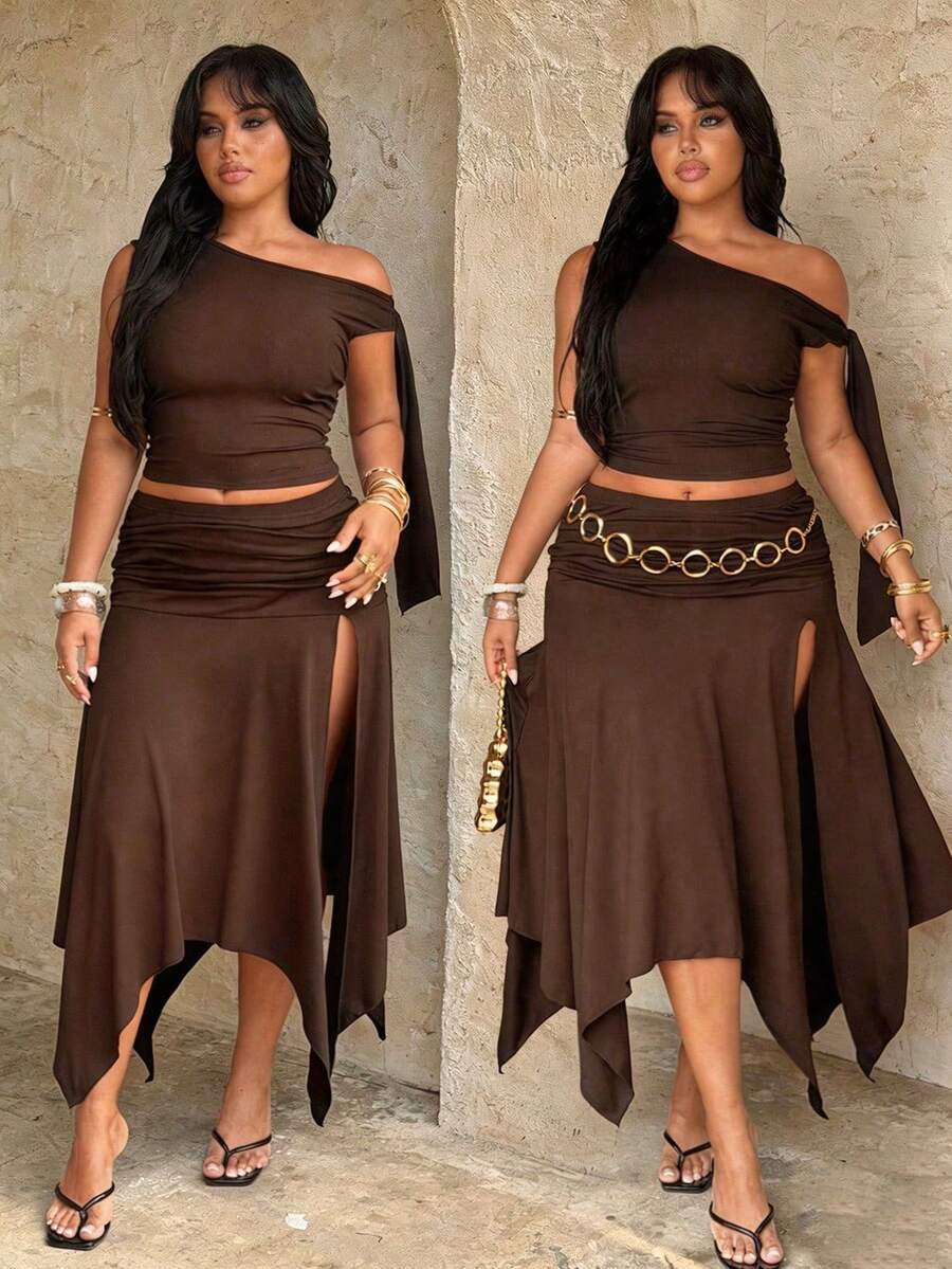 plus size two-piece skirt set in black olive green and brown with asymmetric one-shoulder crop top, draped shoulder tie panel, high waist ruched midi skirt, handkerchief hem and high thigh slit image 8