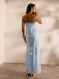 4 media show light baby blue spaghetti strap cowl neck maxi dress with sheer overlay, tiered iridescent fringe, fitted body, open back zipper, floor length, formal evening party identity. image 3