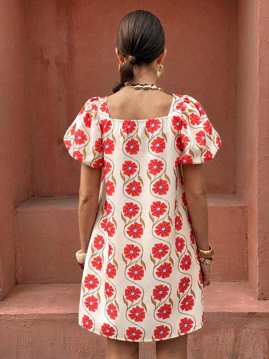 Front view of cream floral square neck mini dress with coral blooms and puff sleeves