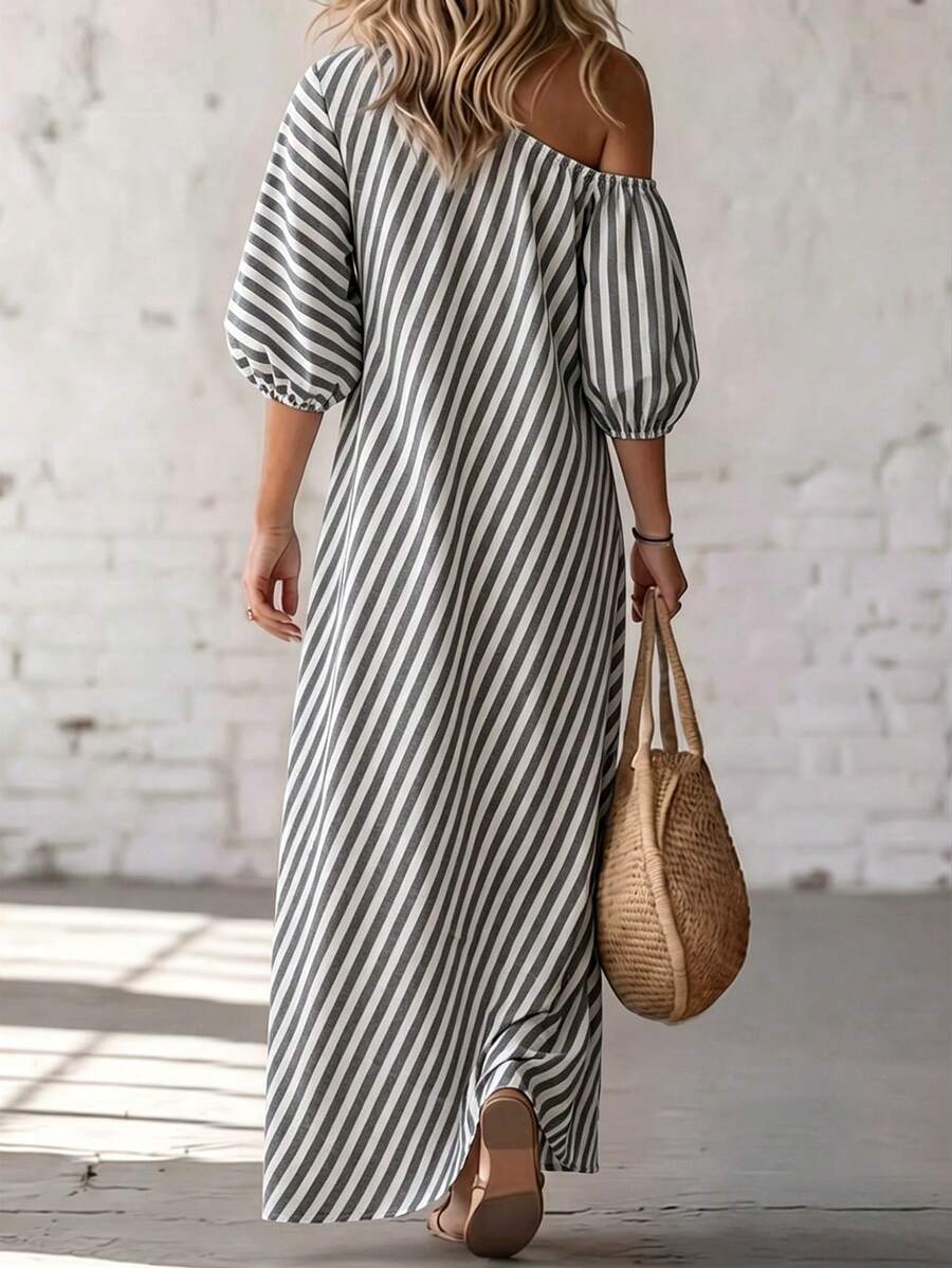 Front view of grey white striped one shoulder maxi dress with cotton comfort label