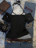 Back flat lay of black off-shoulder top with striped halter layer and sleeve ring accents