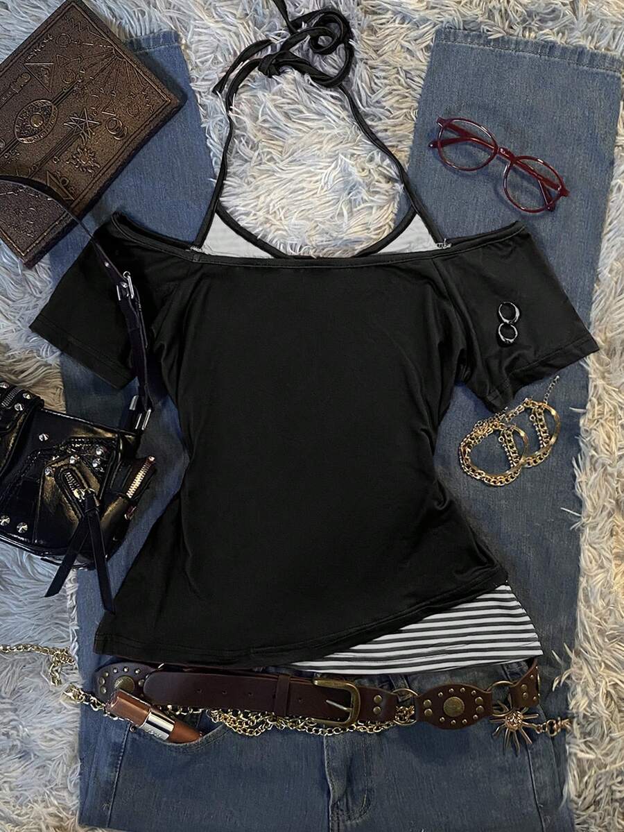 Back flat lay of black off-shoulder top with striped halter layer and sleeve ring accents