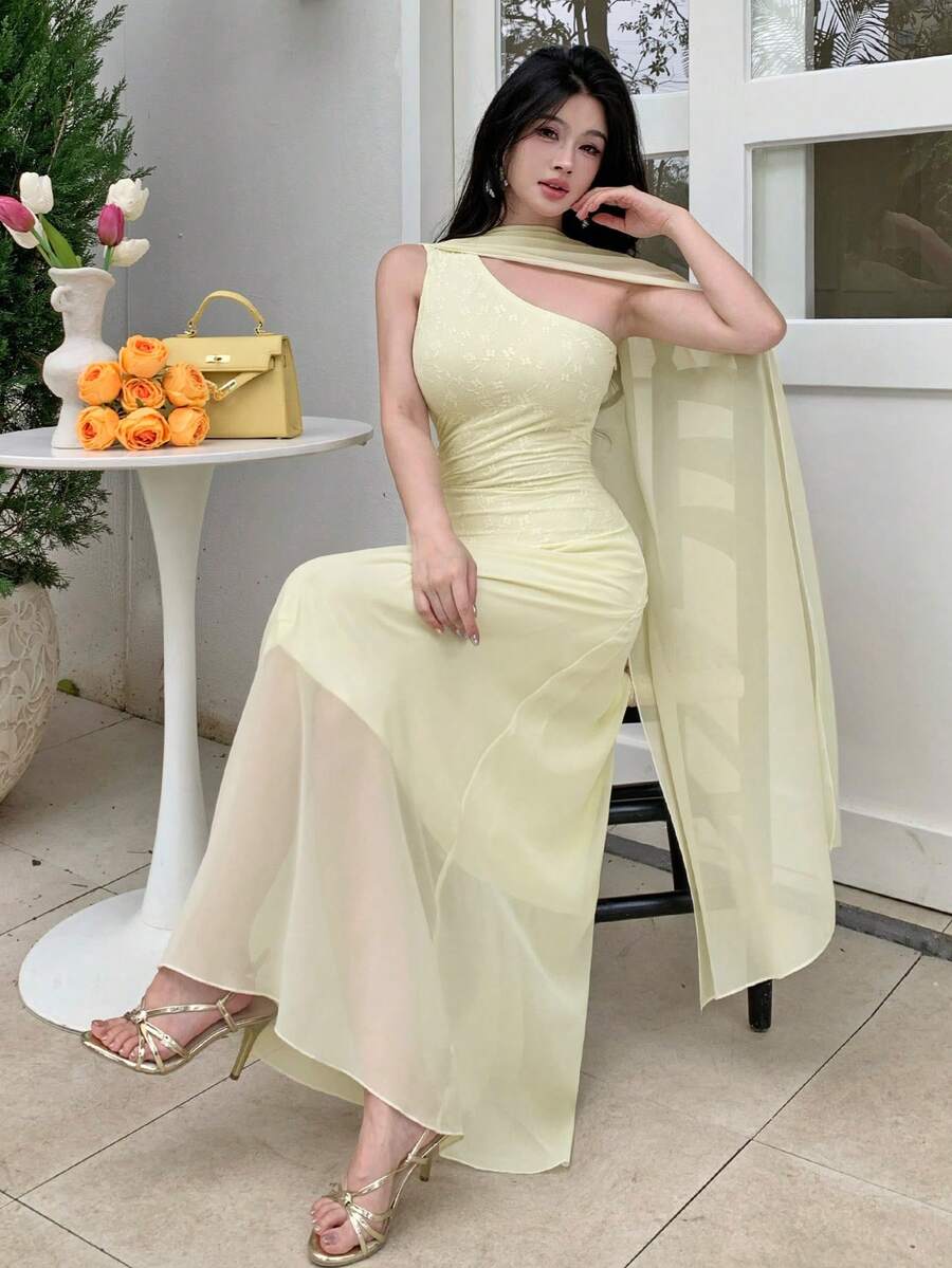 Styled view of pale yellow asymmetrical draped chiffon maxi dress showing visible color, trim, and silhouette