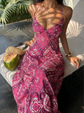 Pink paisley halter maxi dress seated front view with coconut and woven bag