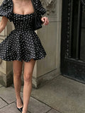 Black square neck polka dot mini dress front view