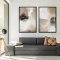 Living room view of neutral abstract wall art set in black frames above leather sofa
