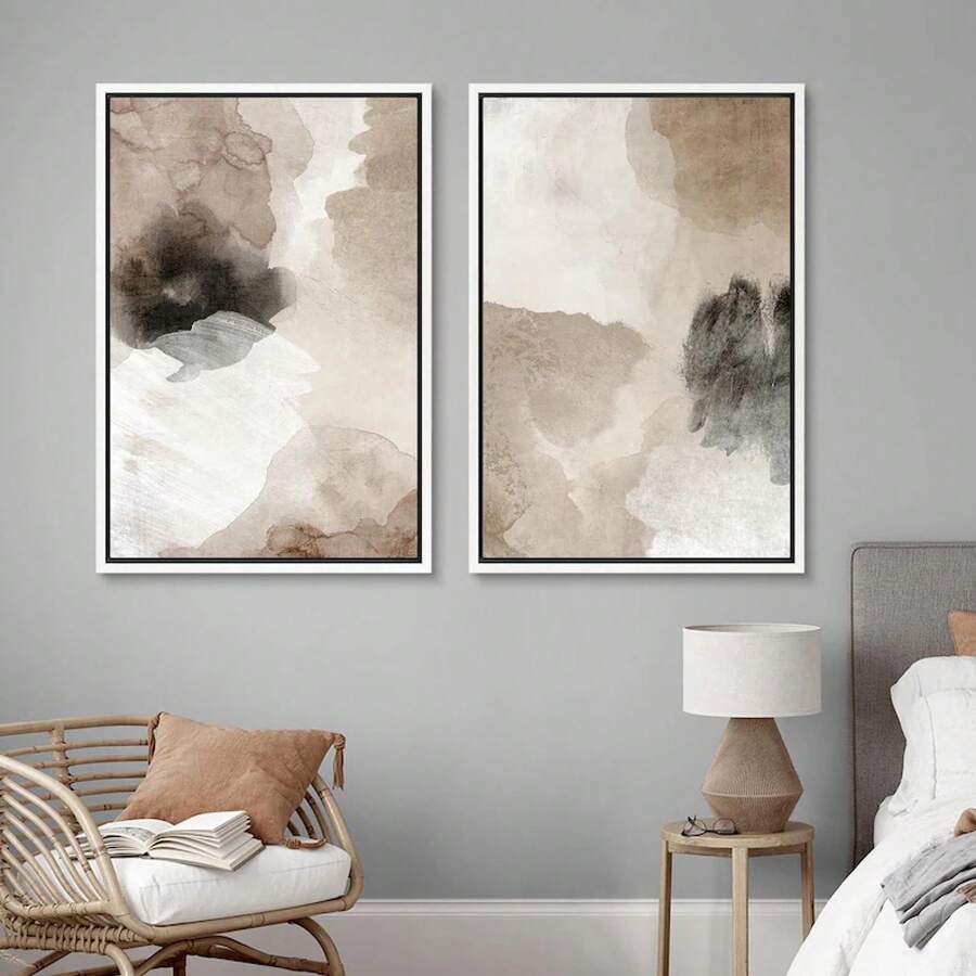 Bedroom corner view of two-piece abstract canvas print set in white frames for calm decor