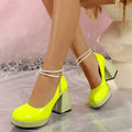10 media show glossy Mary Jane style platform pumps in hot pink, black, burgundy, white and neon lime with closed round toe, chunky block heel, rhinestone platform/heel trim, pearl ankle strap and gold chain charm. image 9