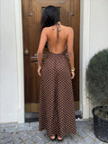 Capture effortless elegance with this blue plaid halter maxi dress, designed to blend classic charm with modern sophistication.