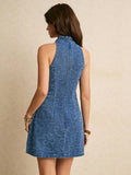 Back view blue denim halter mini dress with floral pattern and center back seam