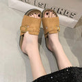 4 media show beige cream and camel tan suede-look buckle slide sandals with wide upper strap, decorative belt overlay, square gold side buckle, cutout slots, belt loops, tan footbed and dark outsole edge. image 3