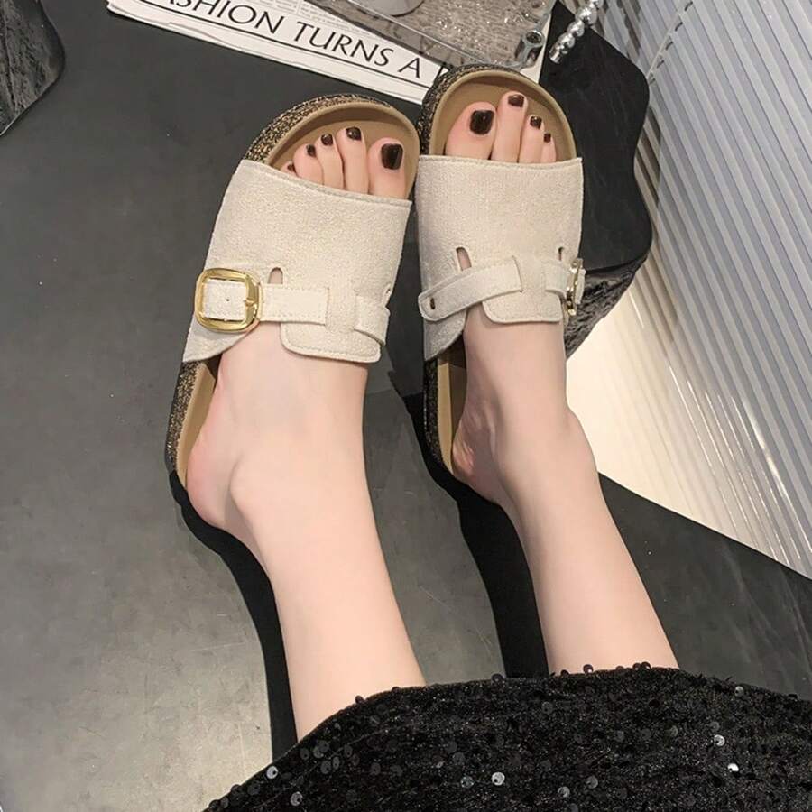 4 media show beige cream and camel tan suede-look buckle slide sandals with wide upper strap, decorative belt overlay, square gold side buckle, cutout slots, belt loops, tan footbed and dark outsole edge. image 1