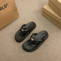 6 media show thong flip-flop slide sandals in cream strap on black sole, all black, and metallic silver strap on black sole with V-shaped toe post strap, broad padded upper, thick black contoured footbed/outsole, small gold metal logo plaque. image 3