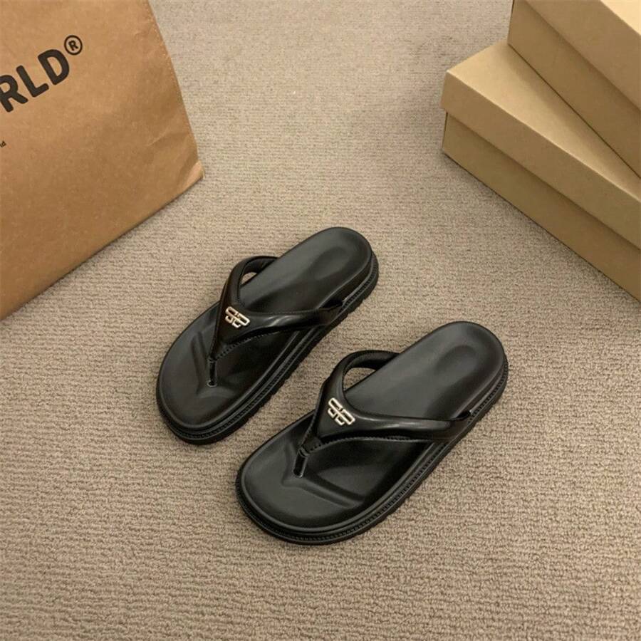 6 media show thong flip-flop slide sandals in cream strap on black sole, all black, and metallic silver strap on black sole with V-shaped toe post strap, broad padded upper, thick black contoured footbed/outsole, small gold metal logo plaque. image 4