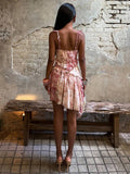 Multicolor floral and paisley mini dress styled for a summer party