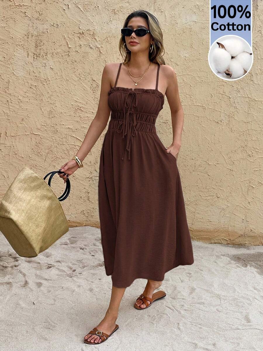 Brown ruched bust midi sundress with 100 percent cotton badge and straw tote
