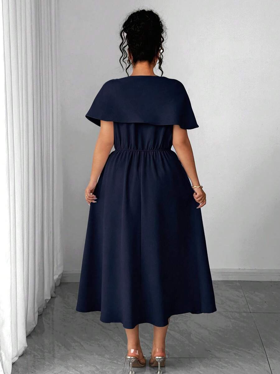 Front view of navy asymmetric rhinestone cape-sleeve formal midi dress