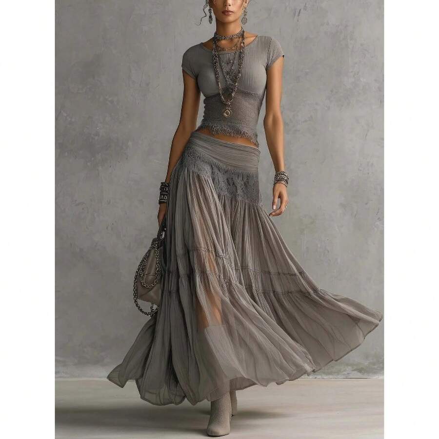 Gray boho two-piece set with ribbed fringe crop top and sheer pleated maxi skirt