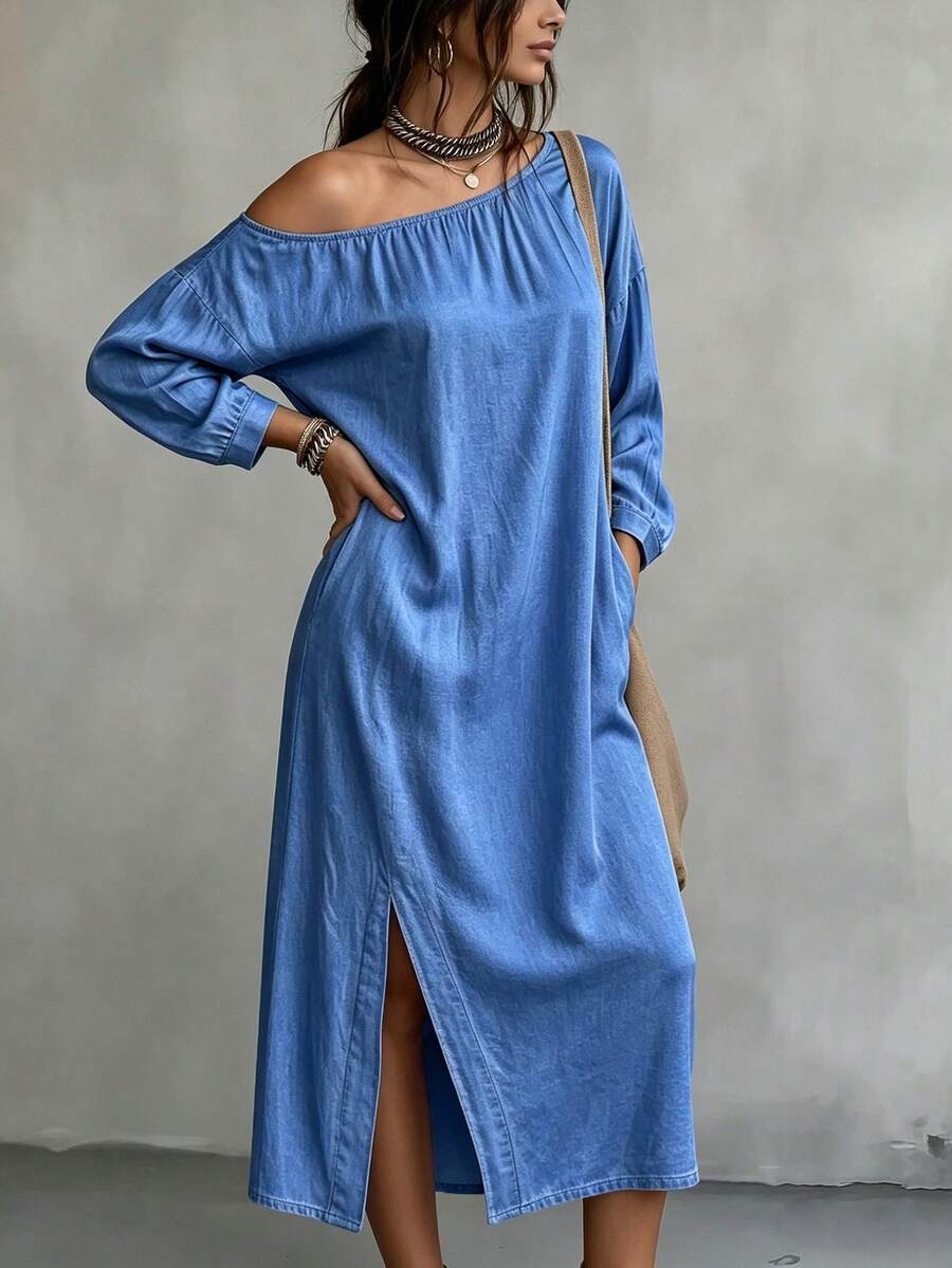 Front view of blue off shoulder denim midi dress with long sleeves and slit