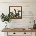 Farmhouse shelf decor with plants candles books and cow art