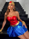 Seated front view of shiny red, blue and gold strapless costume set