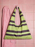 Printed glossy fabric shoulder bag with stitched edges and flat bottom seam