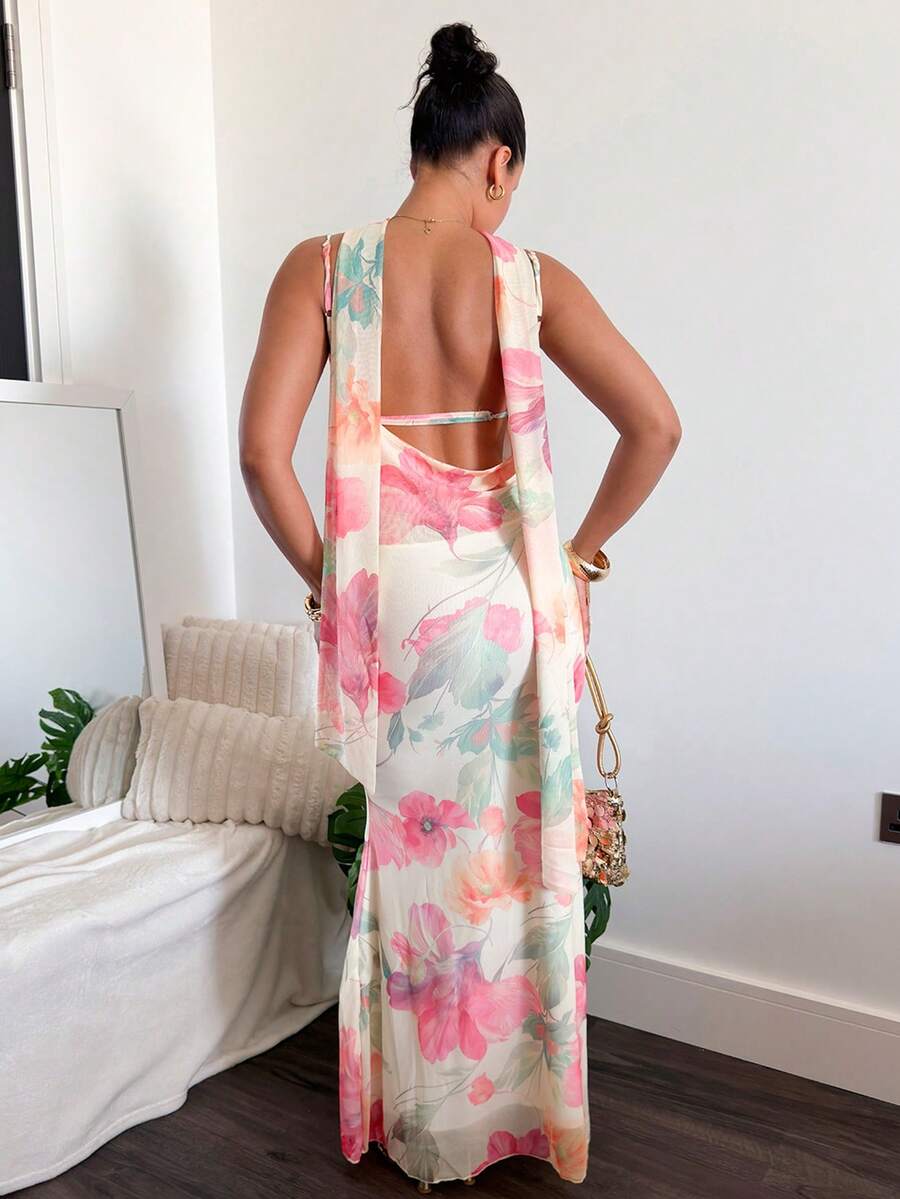 Back view of cream floral dress with low open back and long draped sash
