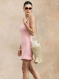 Fish shaped woven beach crossbody bag with tan strap and cream drawstring top