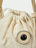 Side view of fish shape beach bag with flared tail and pastel iridescent sequins