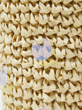 Close view of woven fish bag with cream pouch top and braided raffia texture