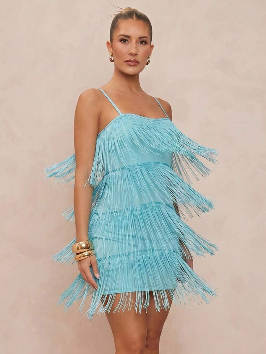 Turquoise fringe mini dress worn on beach