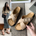 4 media show dusty pink and beige suede-look crisscross slide sandals with gold side buckle, tan molded footbed, stitched welt look, black chunky outsole. image 3