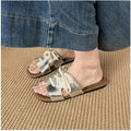 7 media show lace-up flat slide sandals in cream, black, metallic silver and cream black polka dots with H-cut wide vamp strap, sneaker-lace detail, open toe, backless slip-on, brown padded METWO footbed and thin black outsole. image 4
