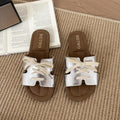 7 media show lace-up flat slide sandals in cream, black, metallic silver and cream black polka dots with H-cut wide vamp strap, sneaker-lace detail, open toe, backless slip-on, brown padded METWO footbed and thin black outsole. image 5