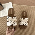 7 media show lace-up flat slide sandals in cream, black, metallic silver and cream black polka dots with H-cut wide vamp strap, sneaker-lace detail, open toe, backless slip-on, brown padded METWO footbed and thin black outsole. image 7