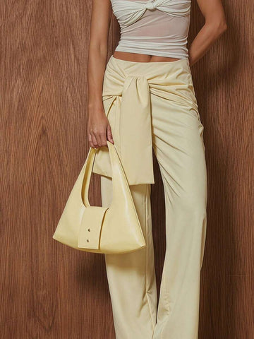 Pale yellow soft fold-over hobo handbag with integrated loop handles