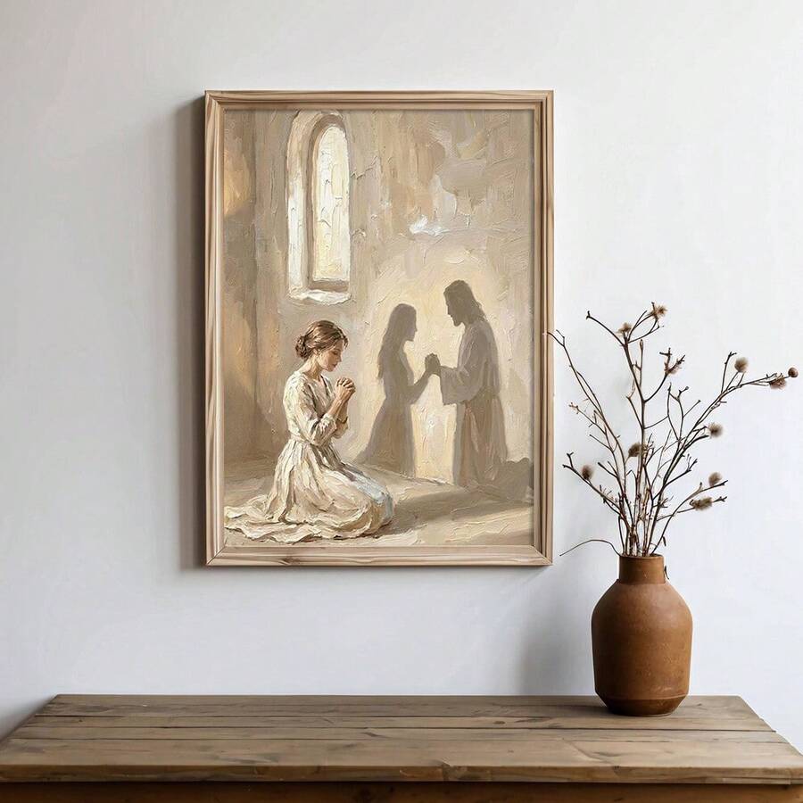 Framed Christian prayer painting above a wood console with a vase of branches