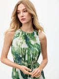 Close-up of pleated green and white tie-dye halter bodice and slim waist belt