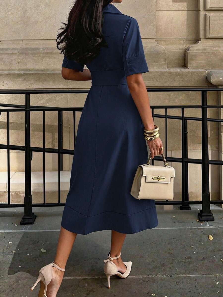 Back view of navy blue short sleeve pleated midi dress