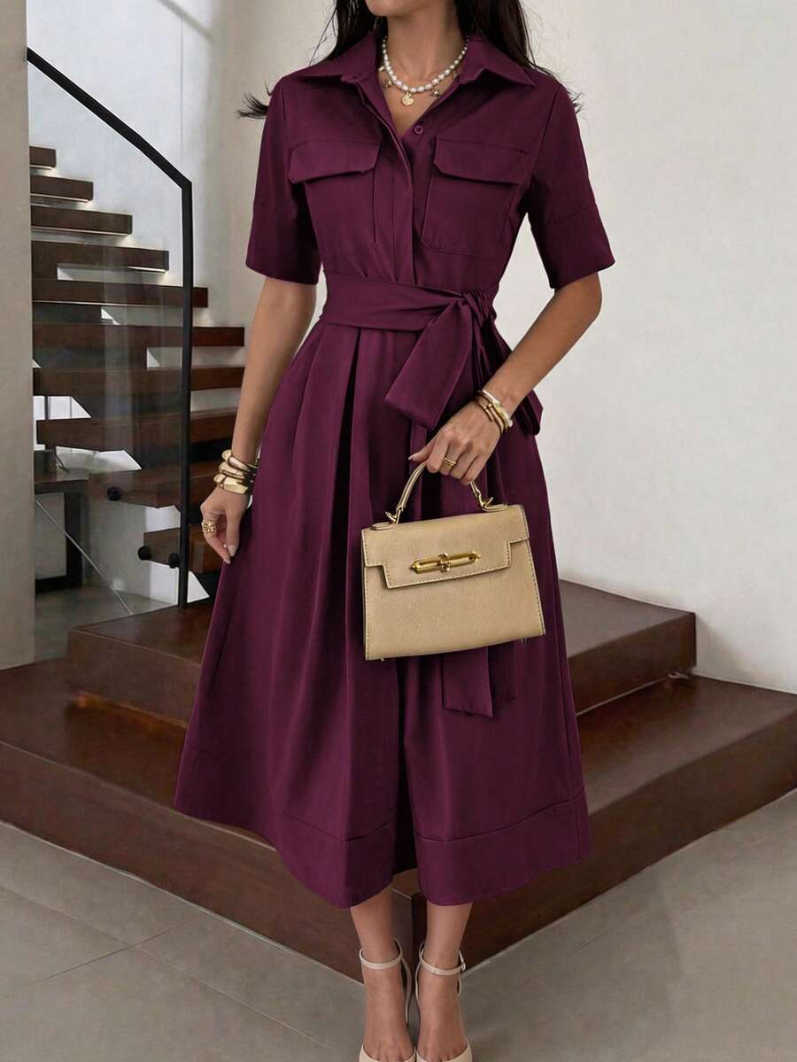 Back view of burgundy short sleeve pleated midi dress