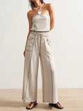 Front view of light stone strapless wide-leg jumpsuit with contrast seams and utility pockets