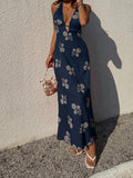 Pale yellow halter dress with botanical print