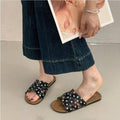 4 media show woven-look flat slide sandals in cream with black dots and black with white dots, interlaced H-style vamp straps, open cutouts, backless slip-on, brown padded METWO footbed and thin black outsole. image 3
