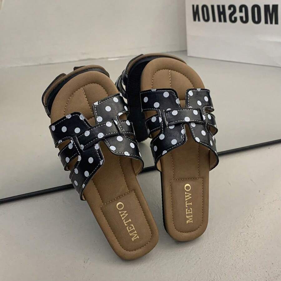 4 media show woven-look flat slide sandals in cream with black dots and black with white dots, interlaced H-style vamp straps, open cutouts, backless slip-on, brown padded METWO footbed and thin black outsole. image 4