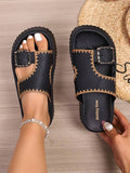 Top view of black slip-on slide sandals with Walking Time footbed text