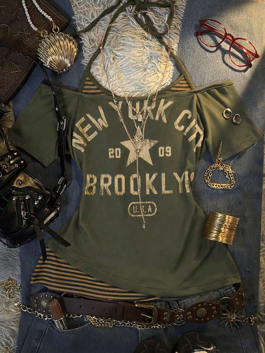 Front flat lay of olive layered graphic T-shirt with New York print and striped halter insert