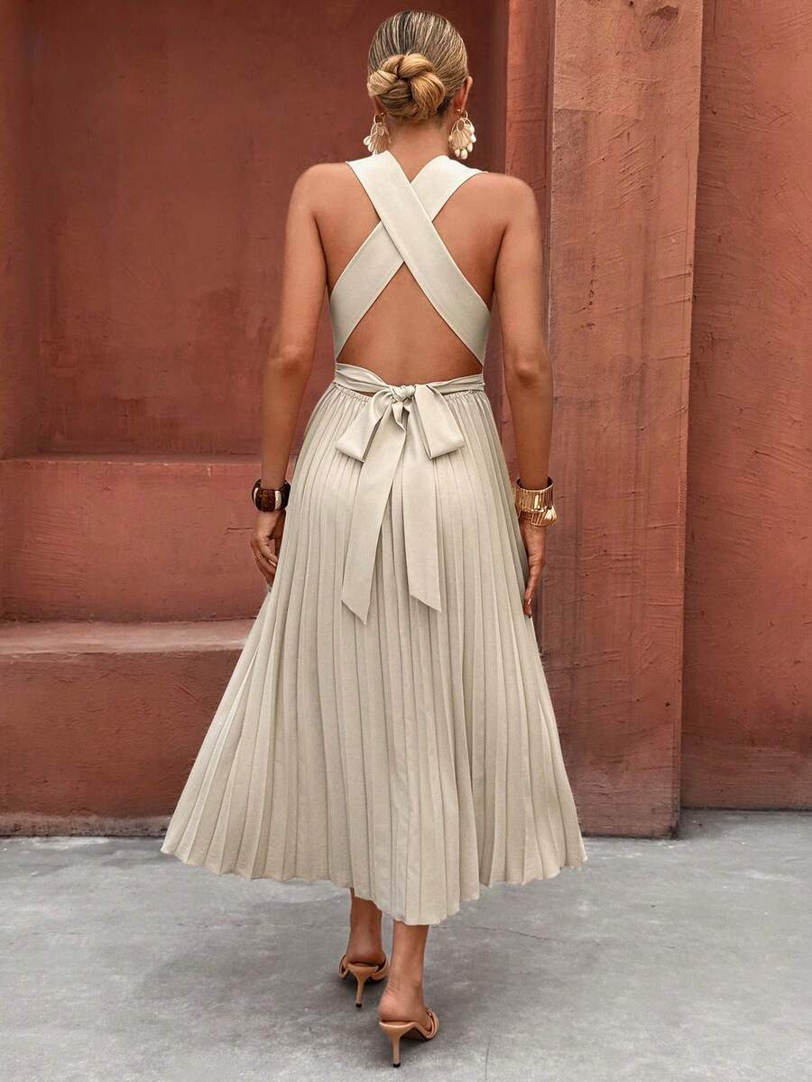 Front view of apricot sleeveless pleated midi dress with wrap V-neck and high waist